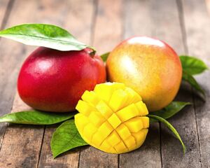 Mango Cut and displayed on wood board